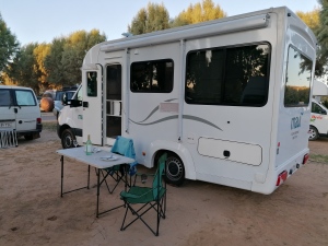 Autocamper parked at a campsite